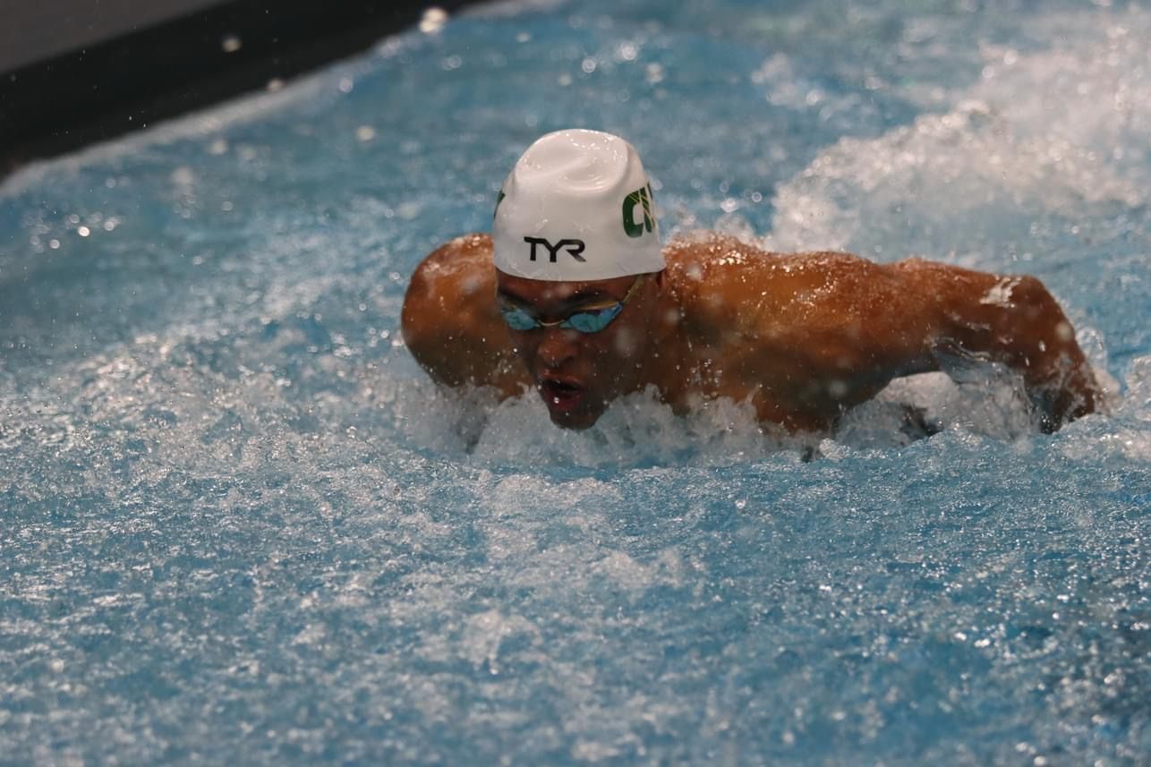 Isaiah competing as a swimmer