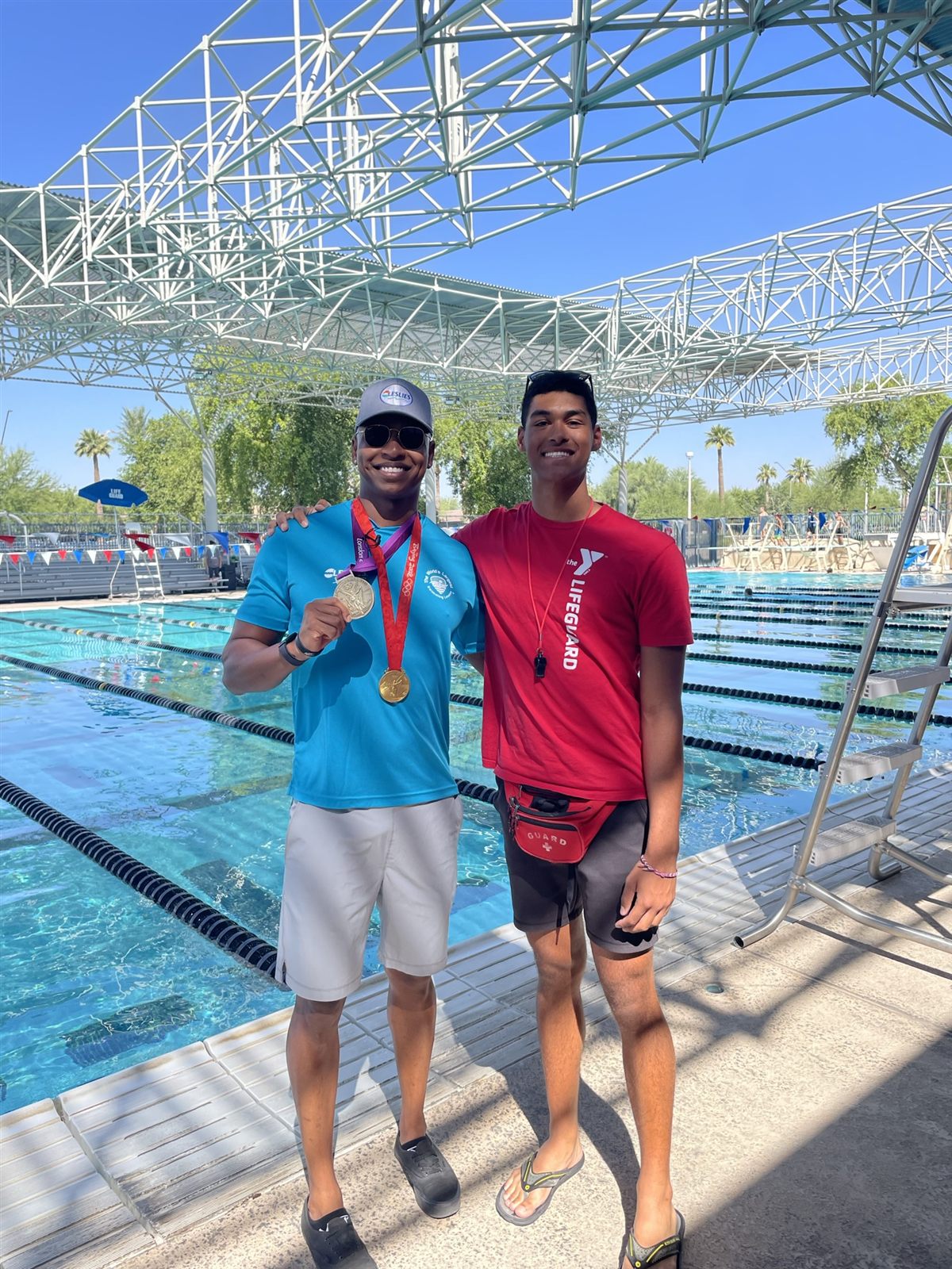 Isaiah teaching water safety in the pool